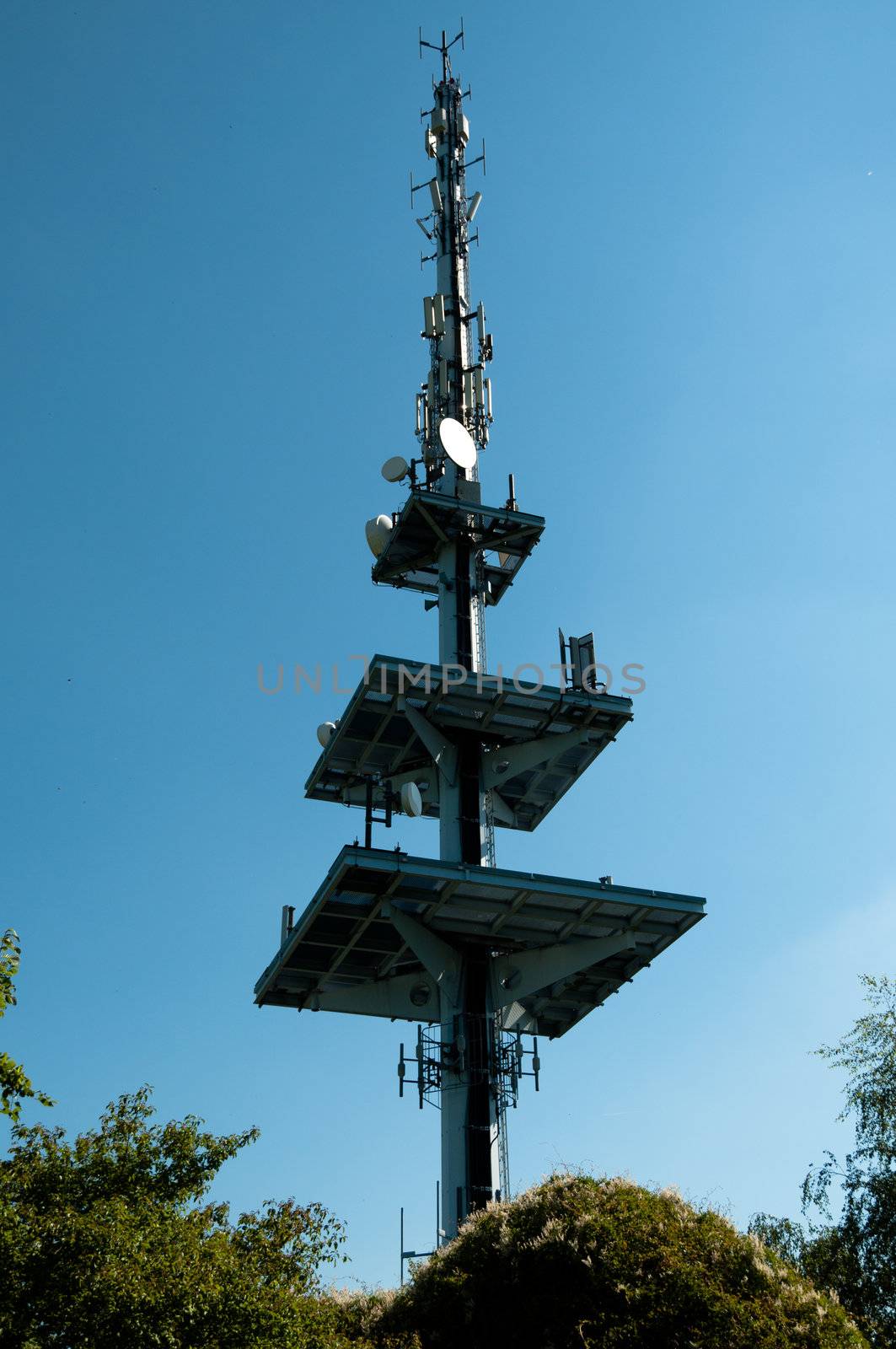 Communication tower consisting of various dishes and antennas.