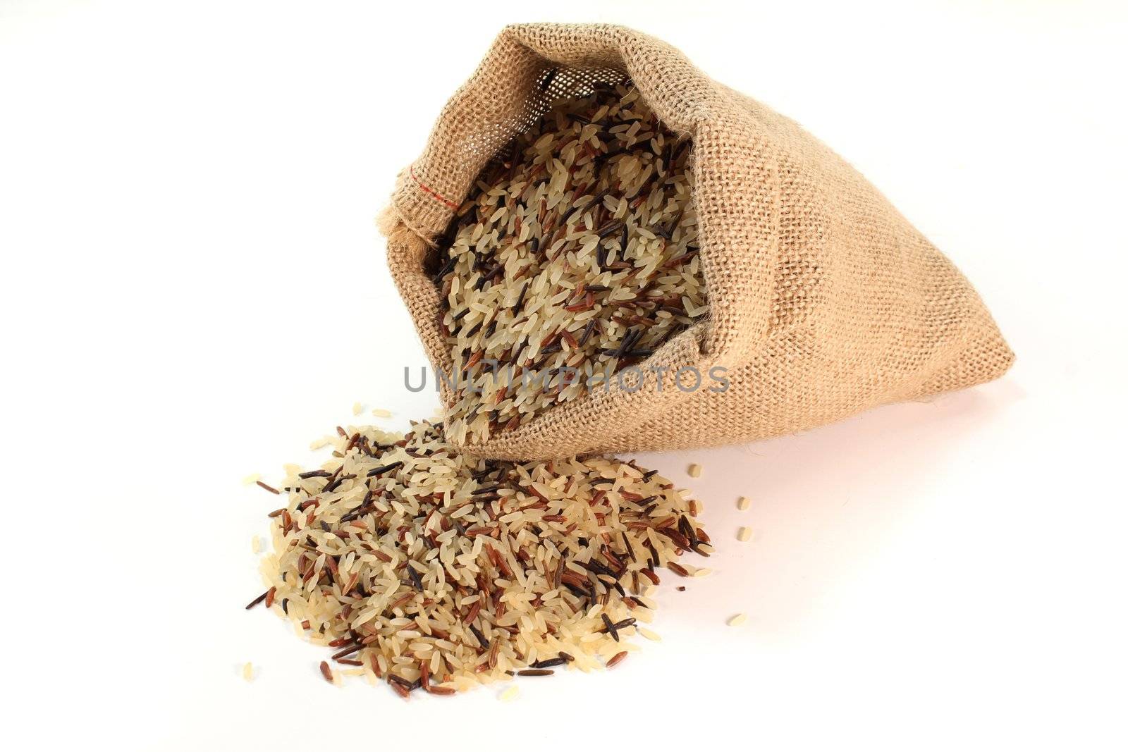 a sack of colored grains of rice on a white background