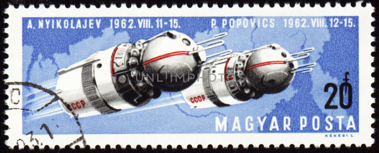 HUNGARY - CIRCA 1962: A stamp printed in Hungary shows soviet spaceships Vostok-3 and Vostok-4 with cosmonauts 

Nikolaev and Popovich in space, circa 1962