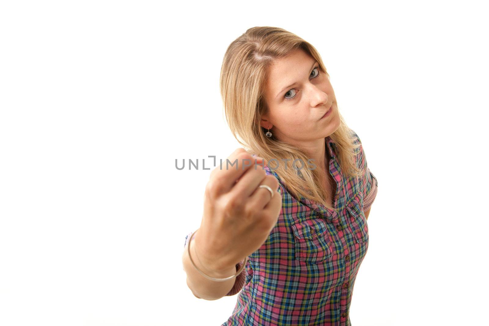 a angry young adult woman threatening with her fist