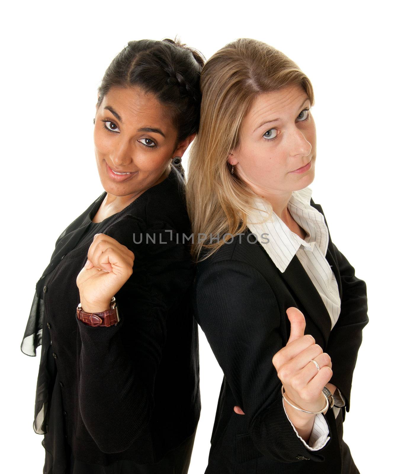 two young businesswoman in a rivaling pose