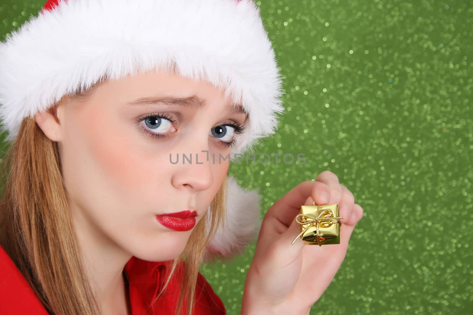 Teenager with red lips wearing a christmas hat