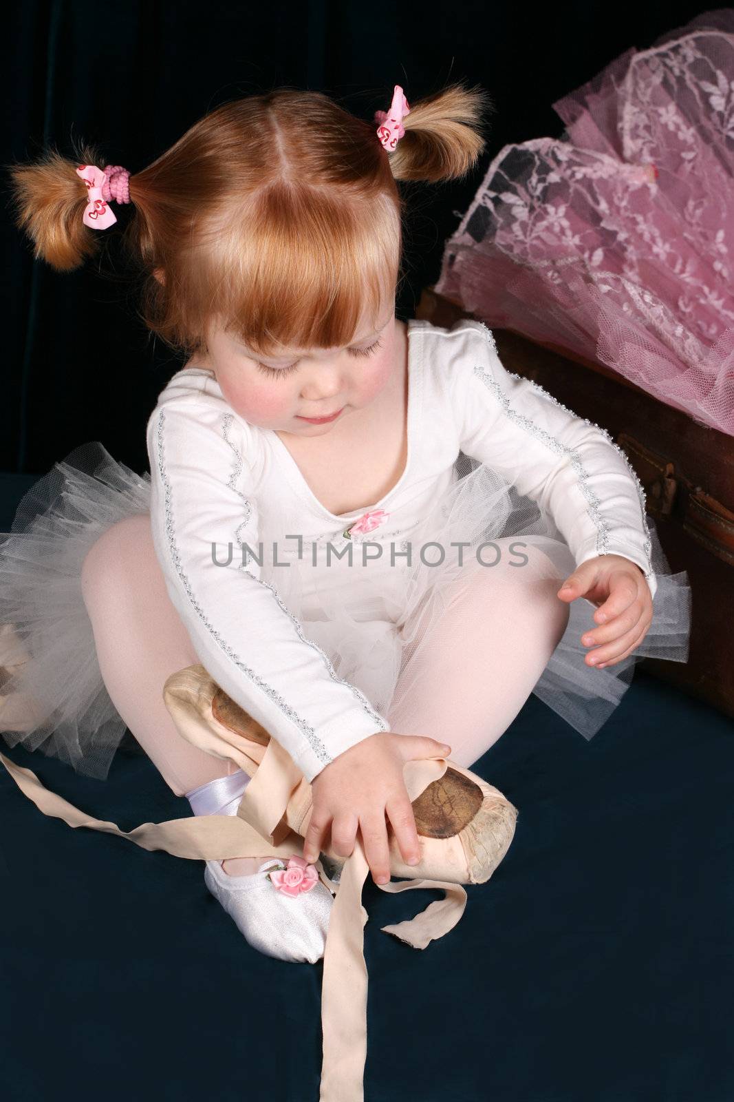 Little ballet toddler wearing a white tutu
