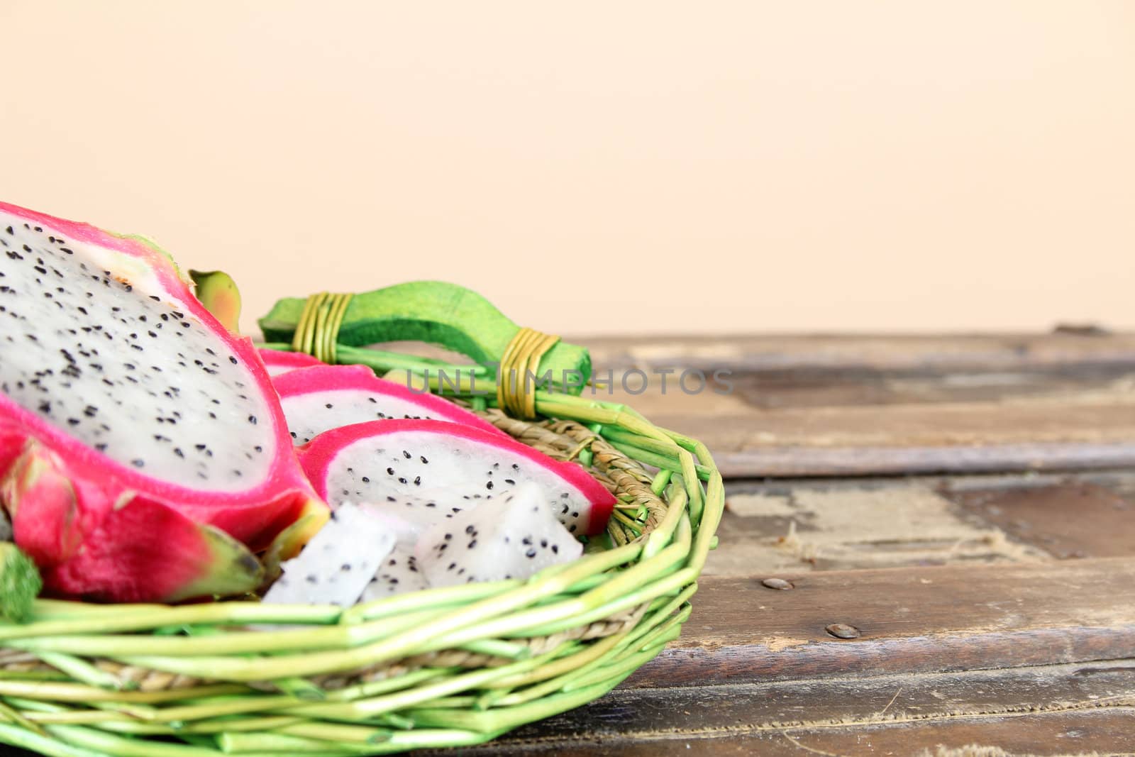 Pink pitahaya dragon fruit basket sliced in pieces 