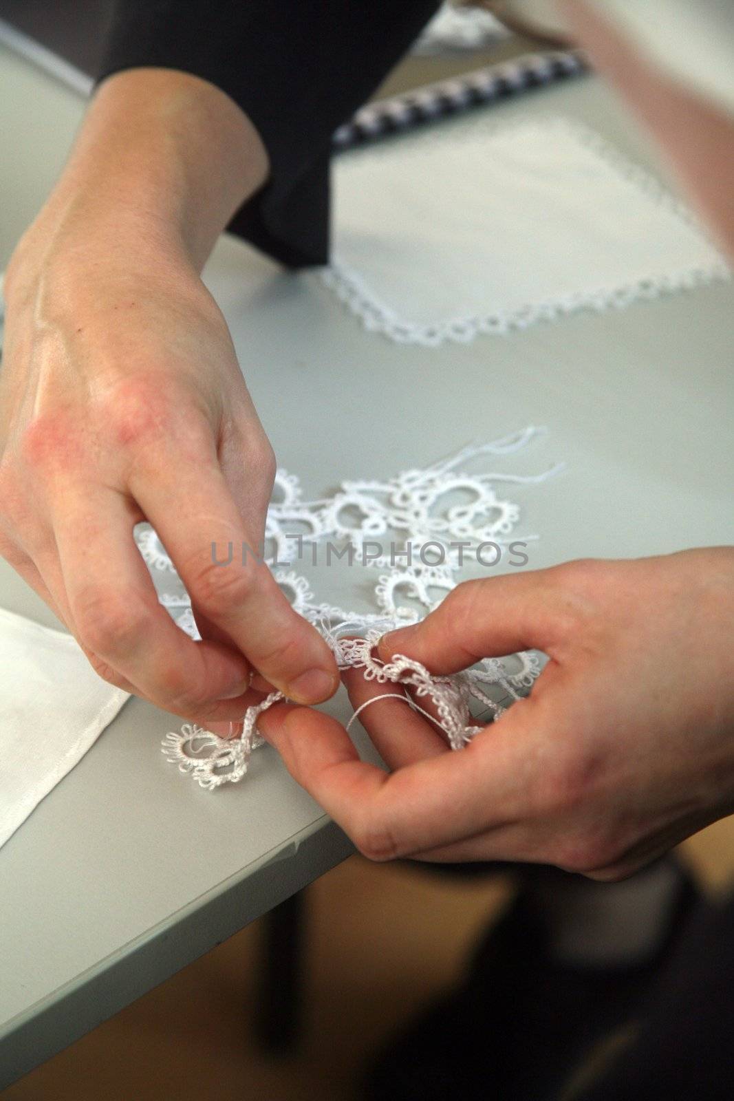 Process of lace-making by atlas