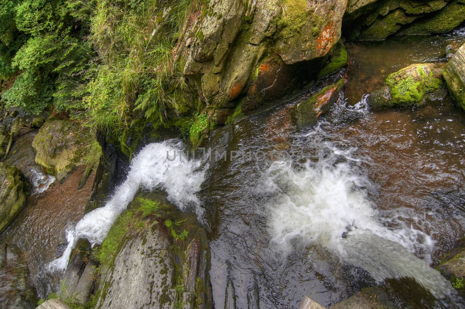 Shot of the fall of water. Stream Huntava - natural area - nature preserve.
Resov, Czech republic, Europe.