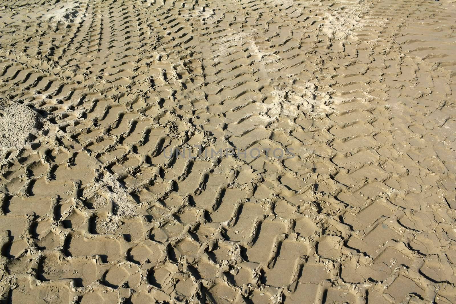 bulldozer track in sand