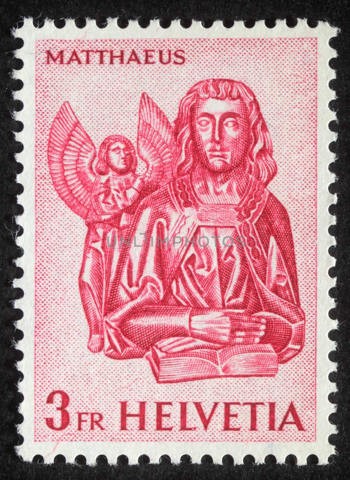 SWITZERLAND - CIRCA 1982 : A s stamp printed in Switzerland showing Saint Matthew the Evangelist