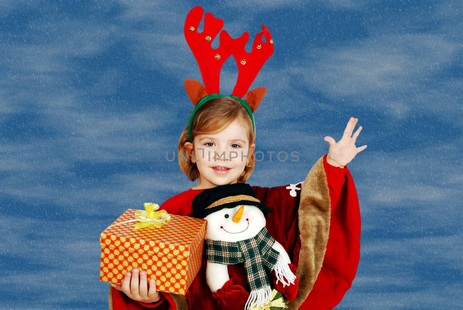 happy little girl holding Christmas gift by goce