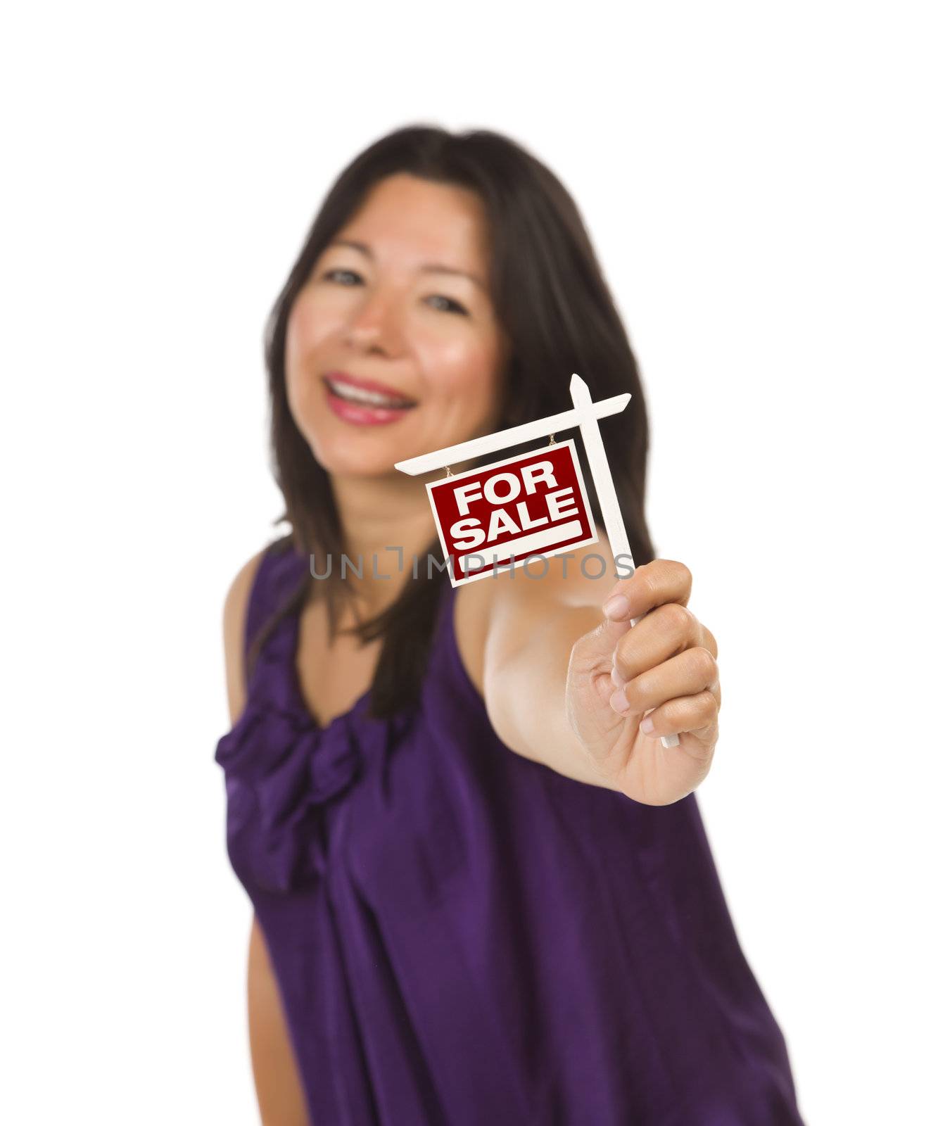 Attractive Multiethnic Woman Holding Small For Sale Real Estate Sign in Hand Isolated on White Background.