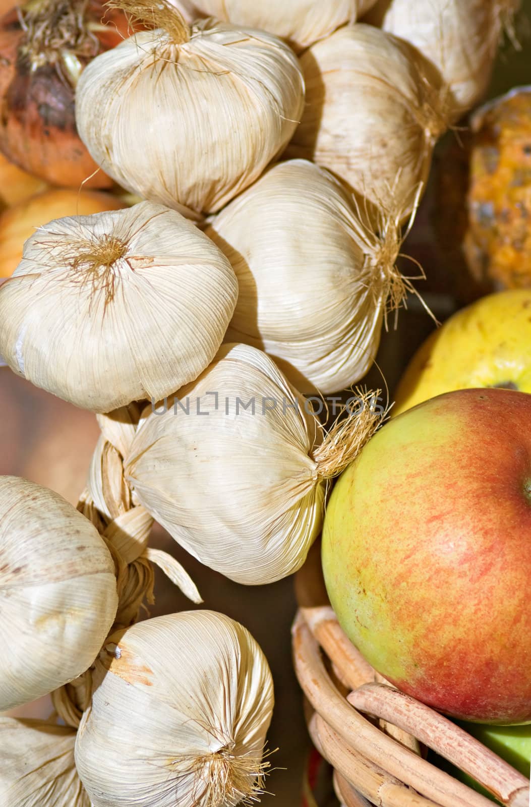 rustic collection of garlic bulbs and cloth 
