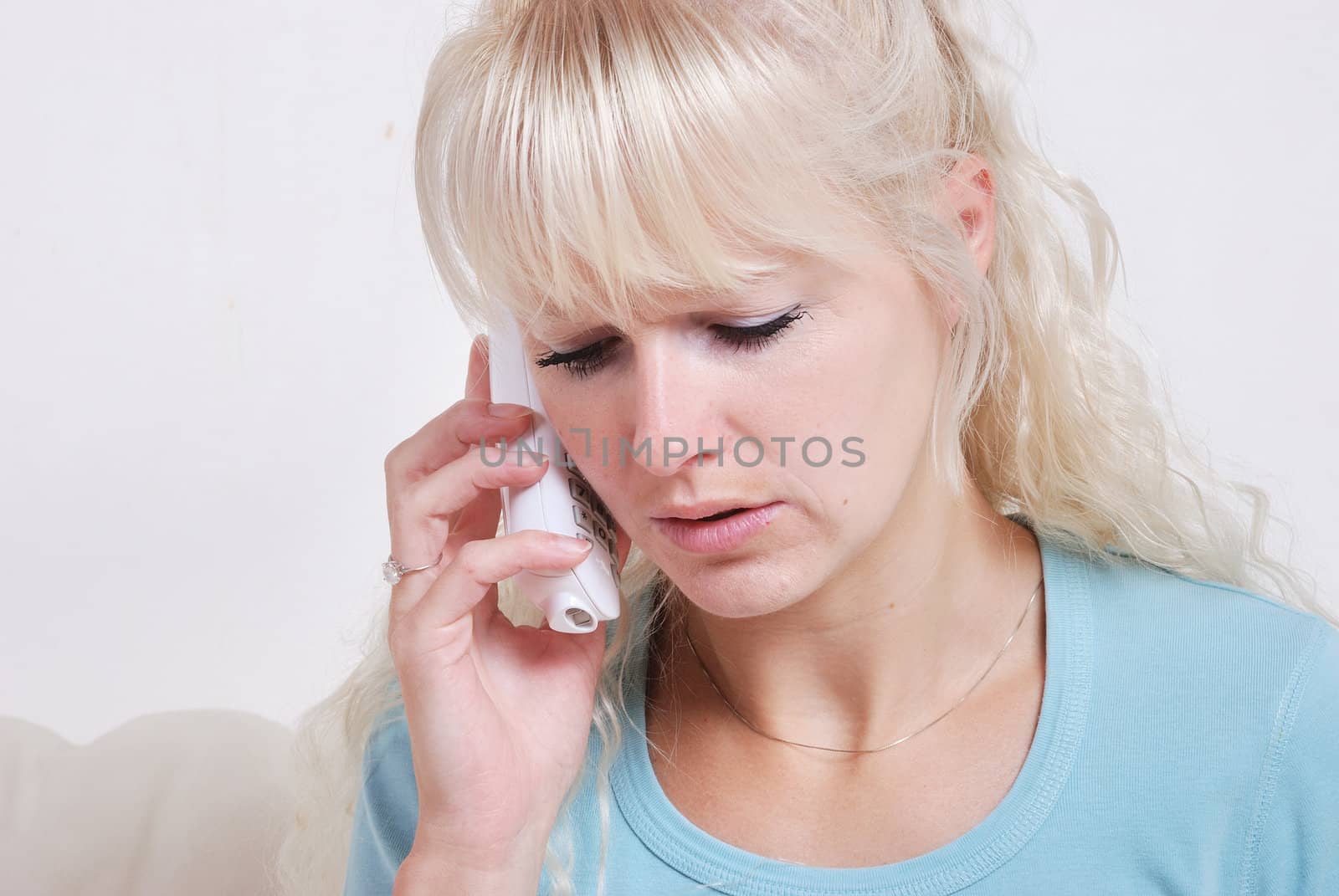 Blond woman phoning