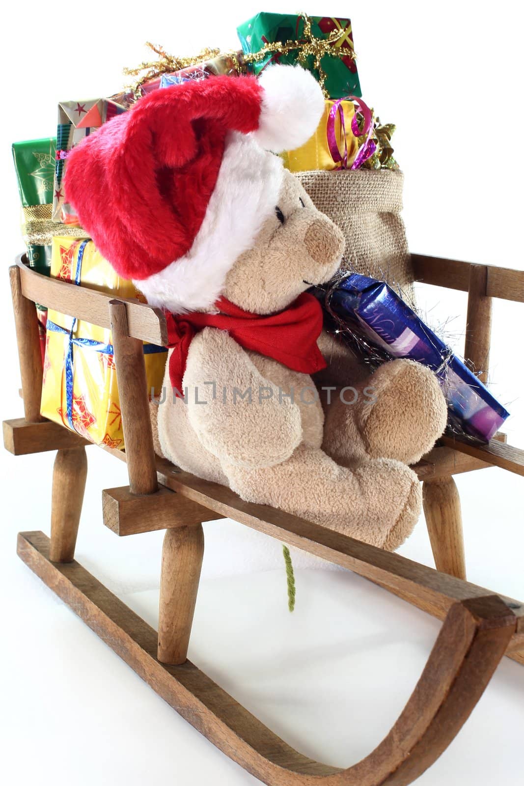 a teddy bear with colorful Christmas presents