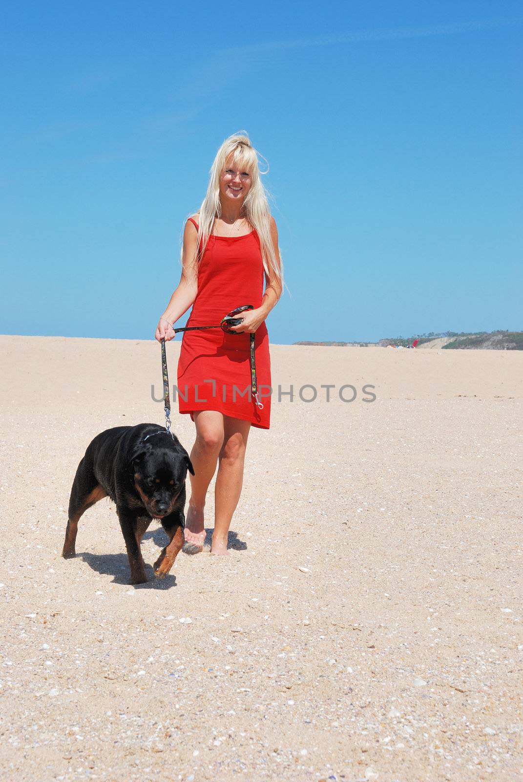 woman at beach with dog