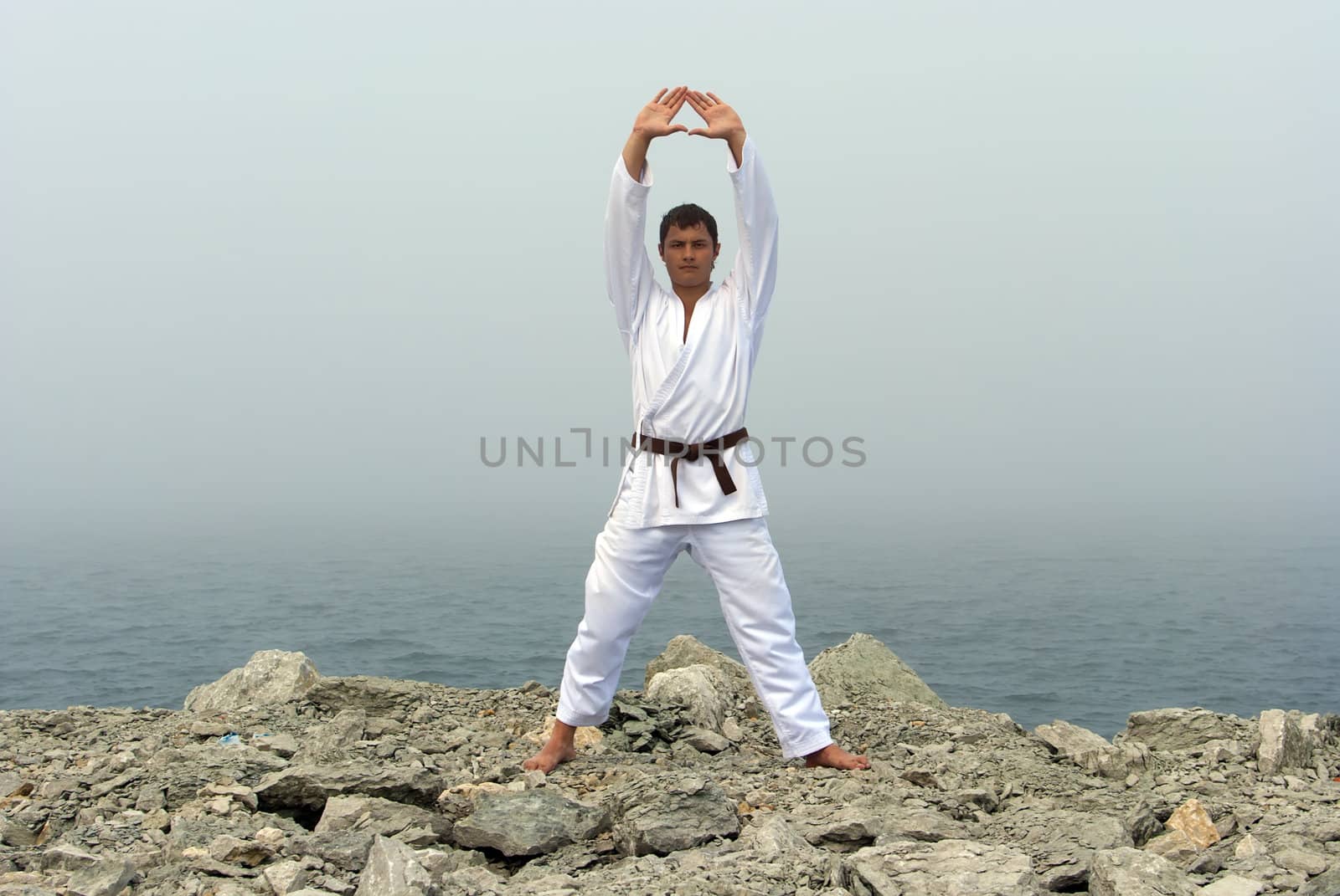 karate trains on the shores of the misty sea