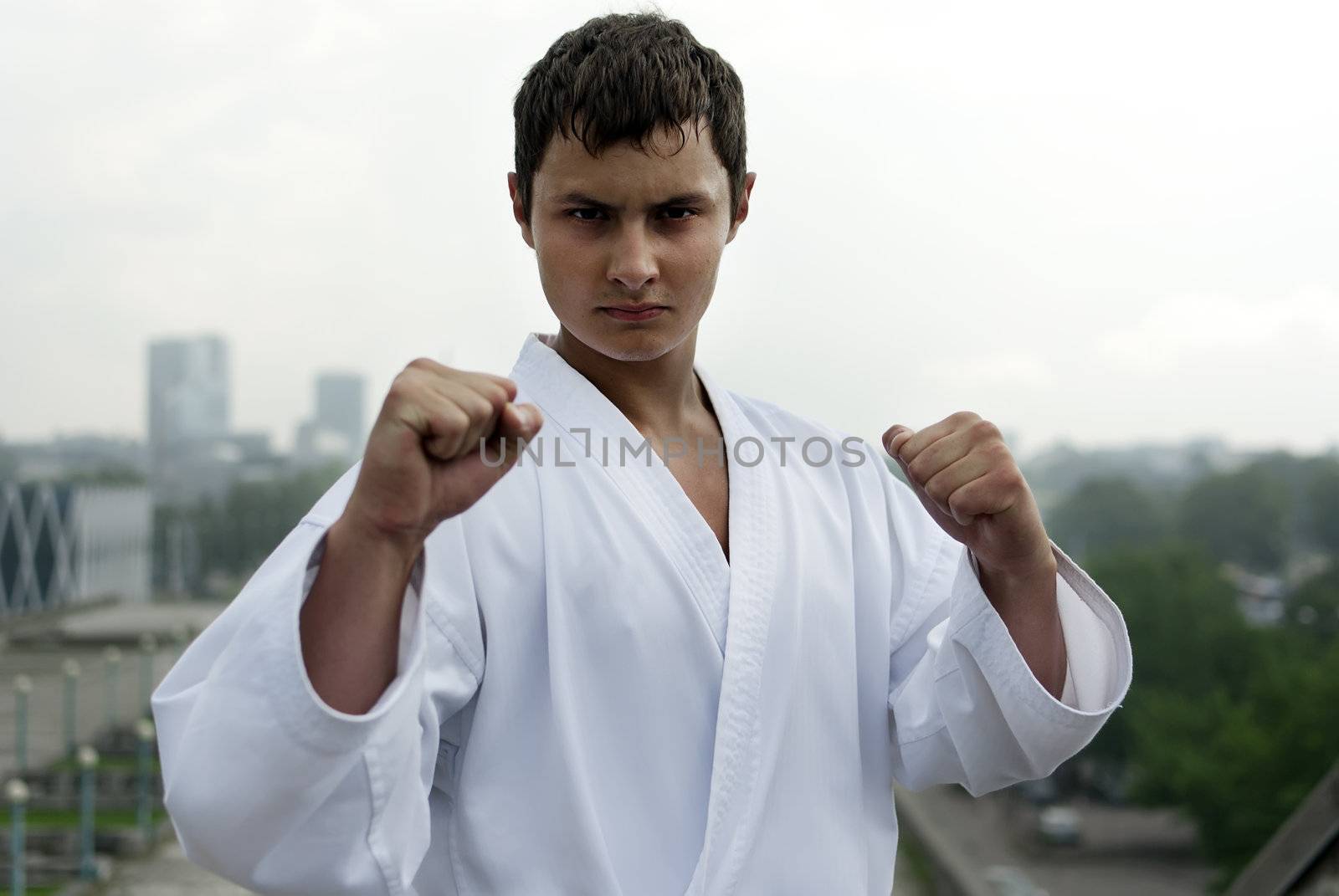 karate poses against the backdrop of the city