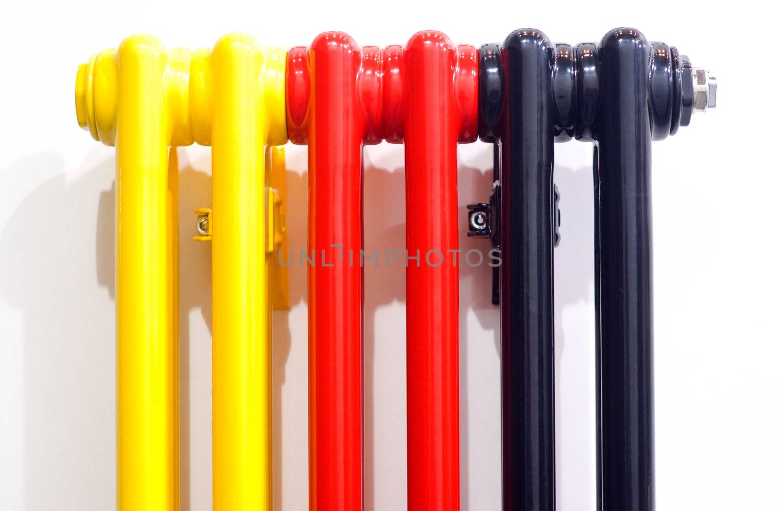 red, yellow, black radiator in an old-style