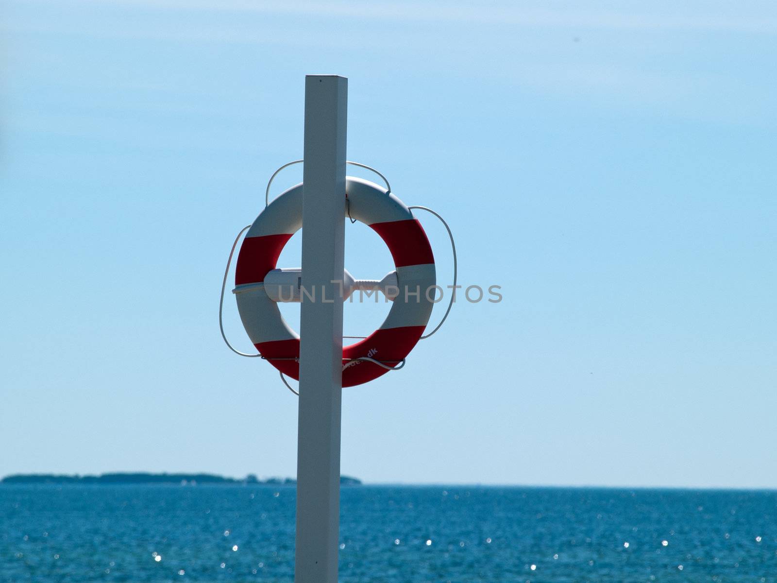 Life buoy / Life Preserver / Life ring / Life belt with clear blue sea ocean background