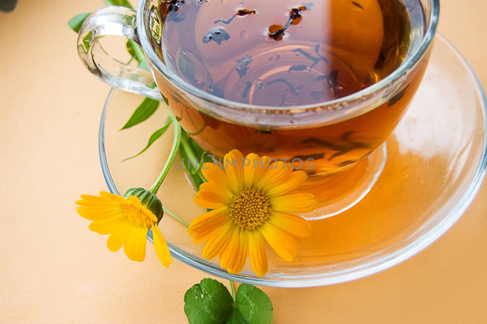 Tea cup with calendula flowers