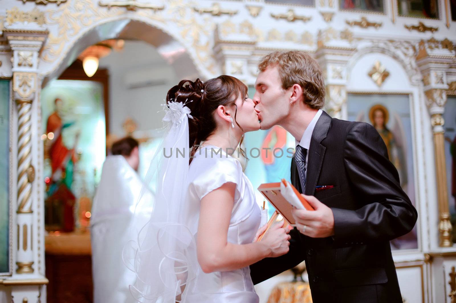 Newlyweds kiss. by negativ