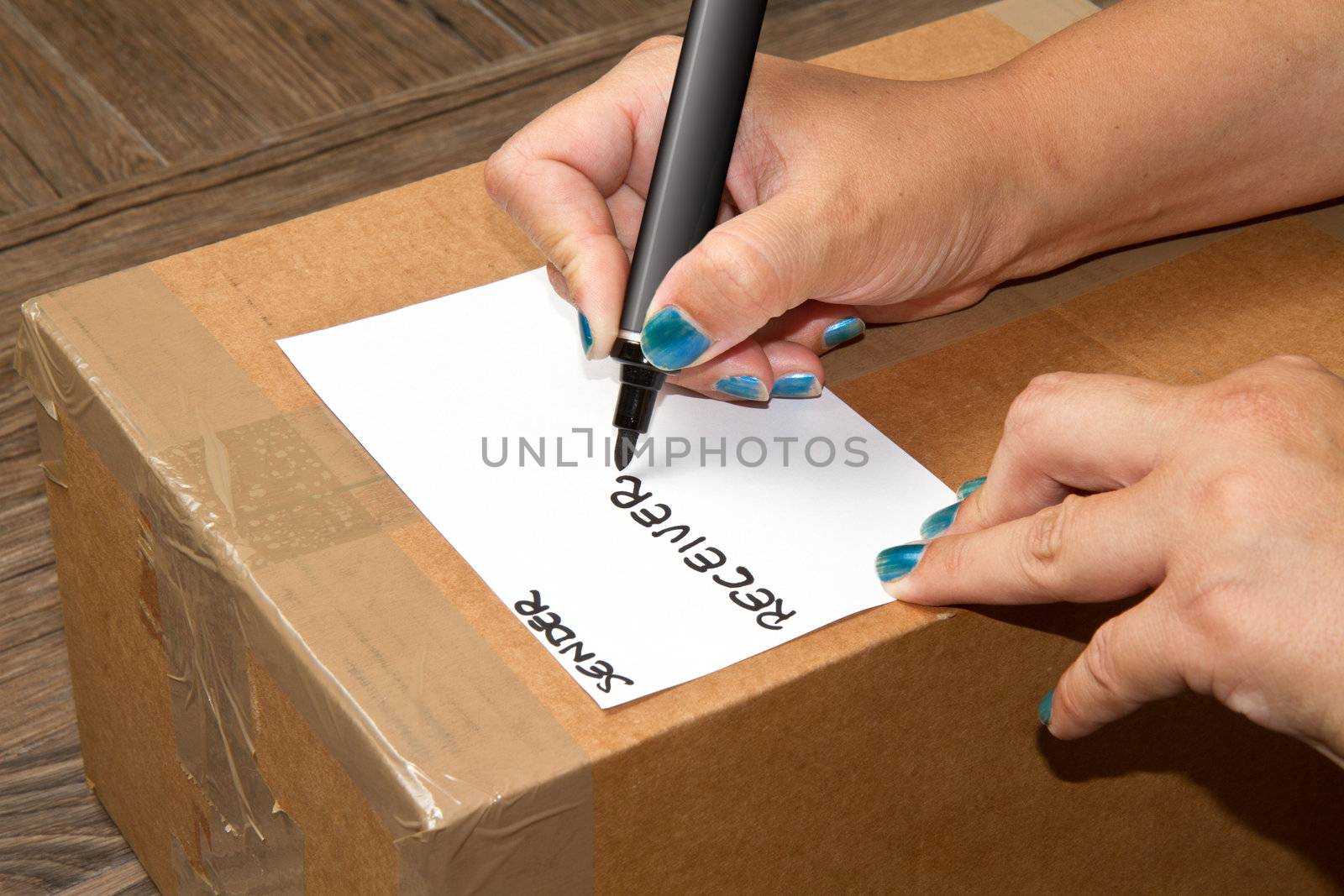 pen on cardboard box with handle