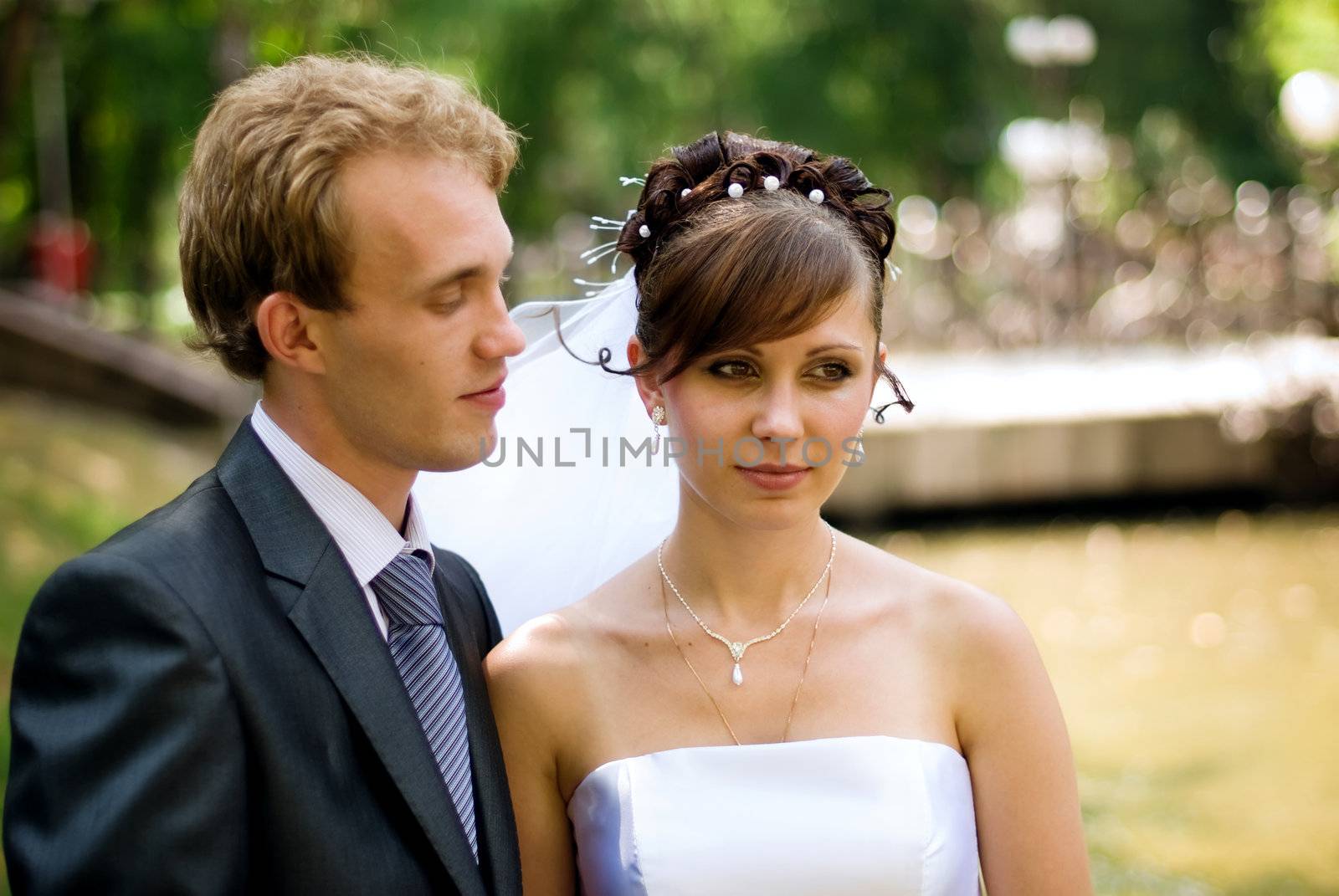 Bride and groom, looking at each other straight in the eye