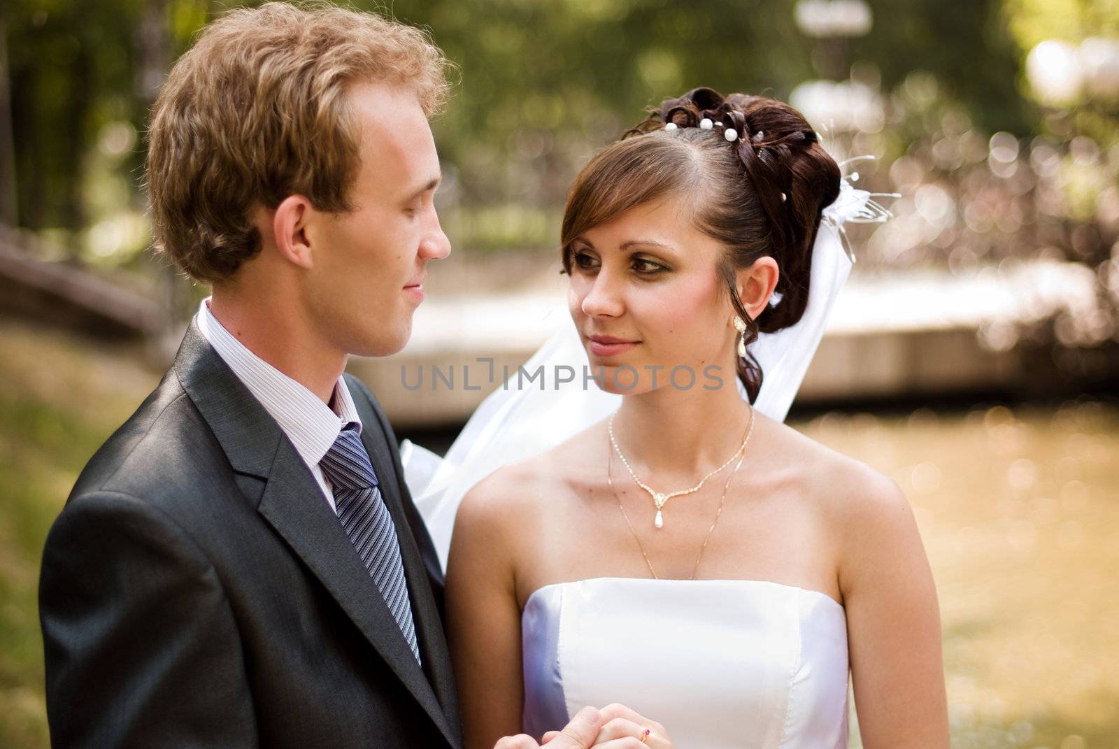 Bride and groom, looking at each other straight in the eye