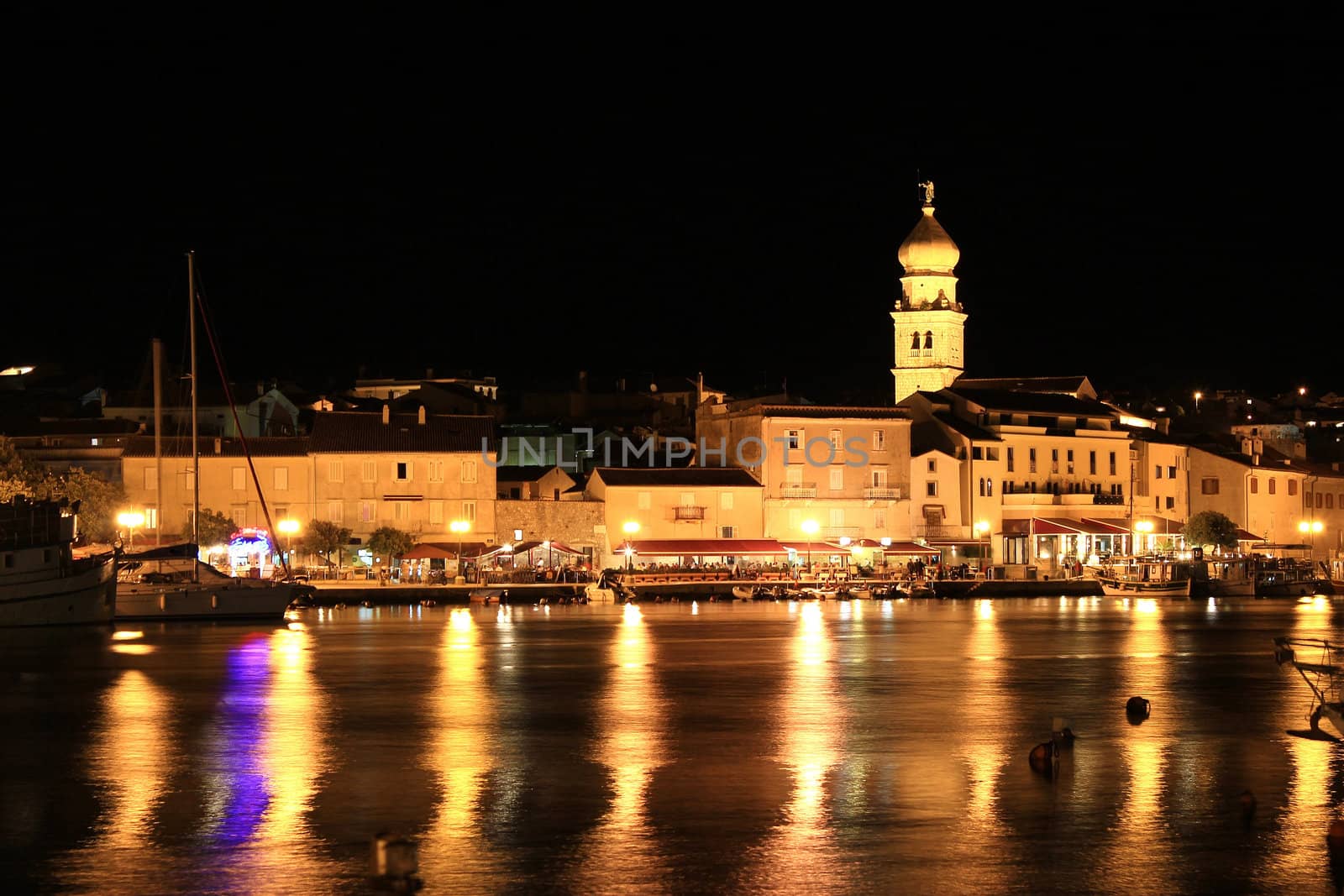 Evening in the Town of Krk, Croatia, reflections of waterfront