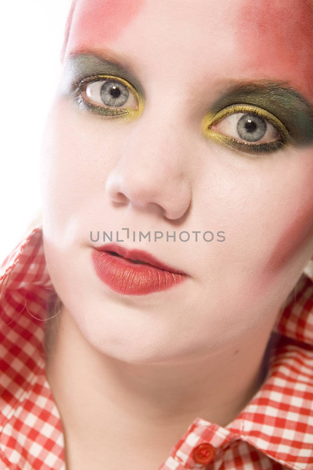 Studio portrait of a blond young lady with heave red make-up