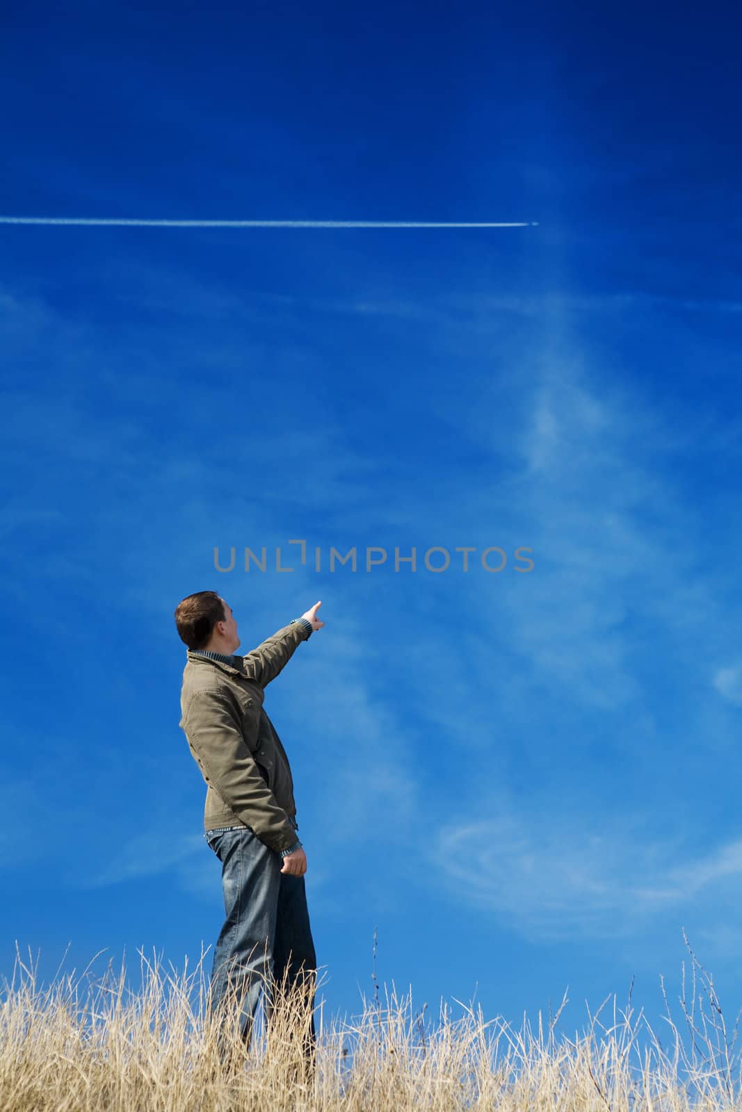 positive man shows the airplane