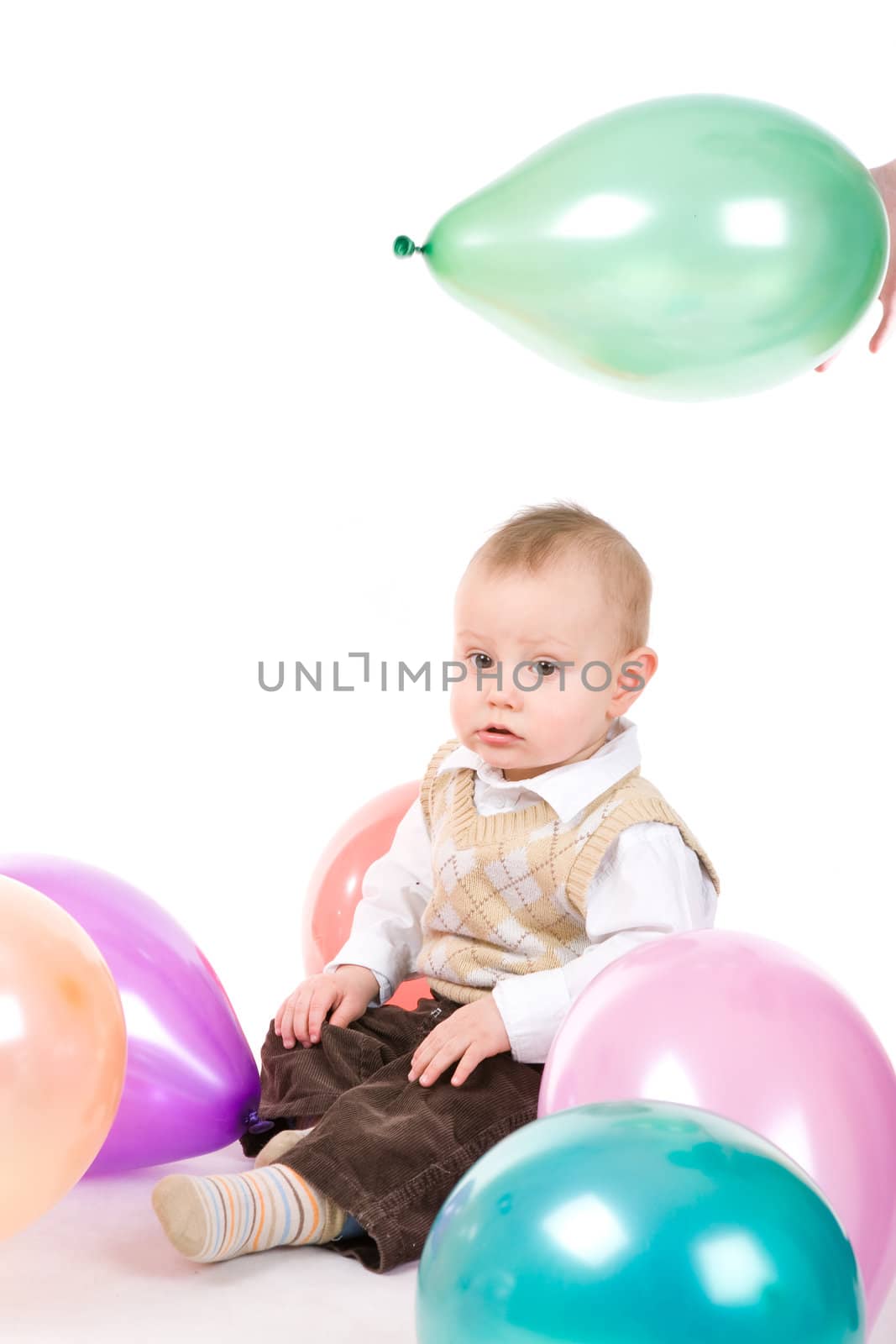 small boy with balloons