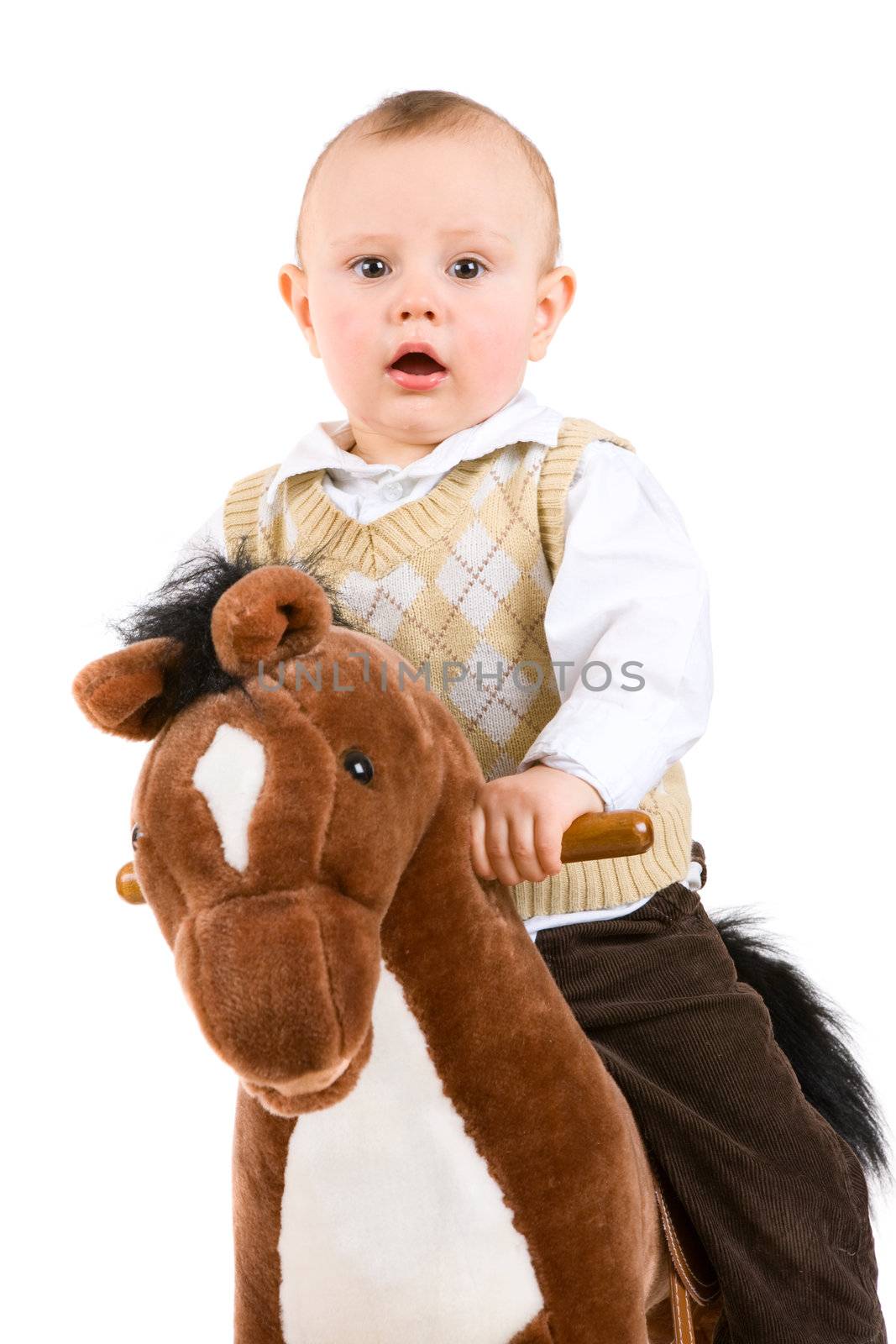 boy of one year riding a toy-horse