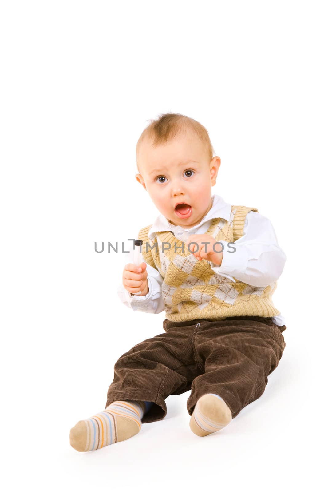 small boy with open mouth on the floor