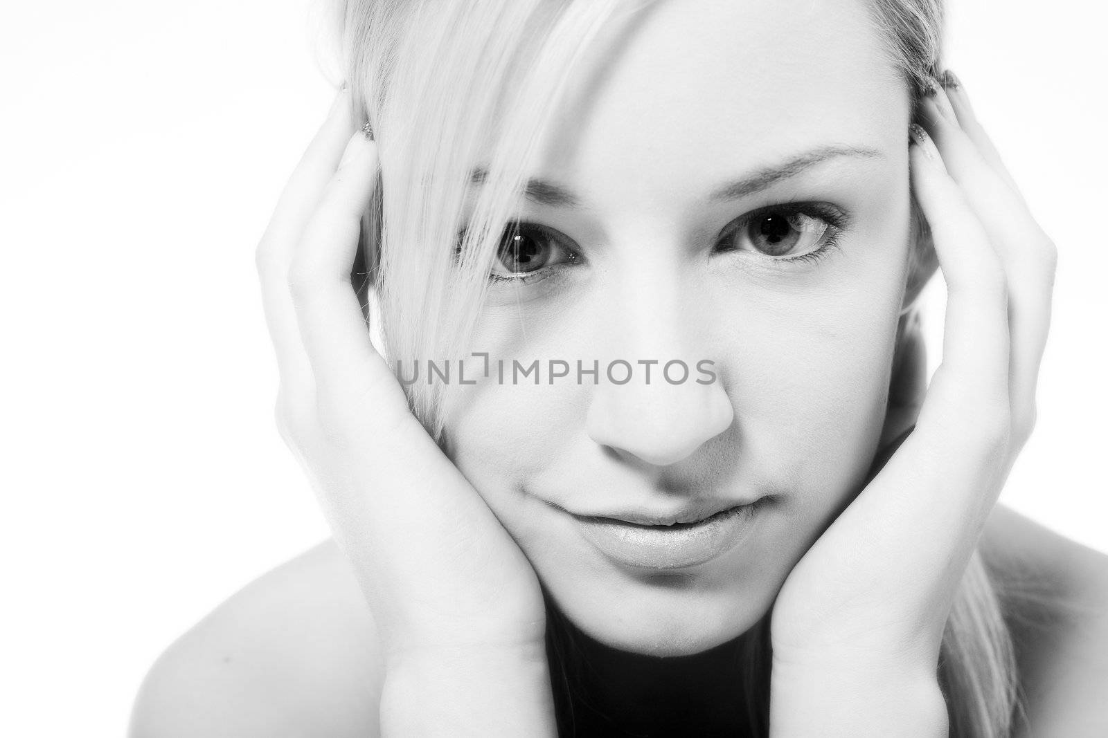 Studio portrait of a young blond woman flirting