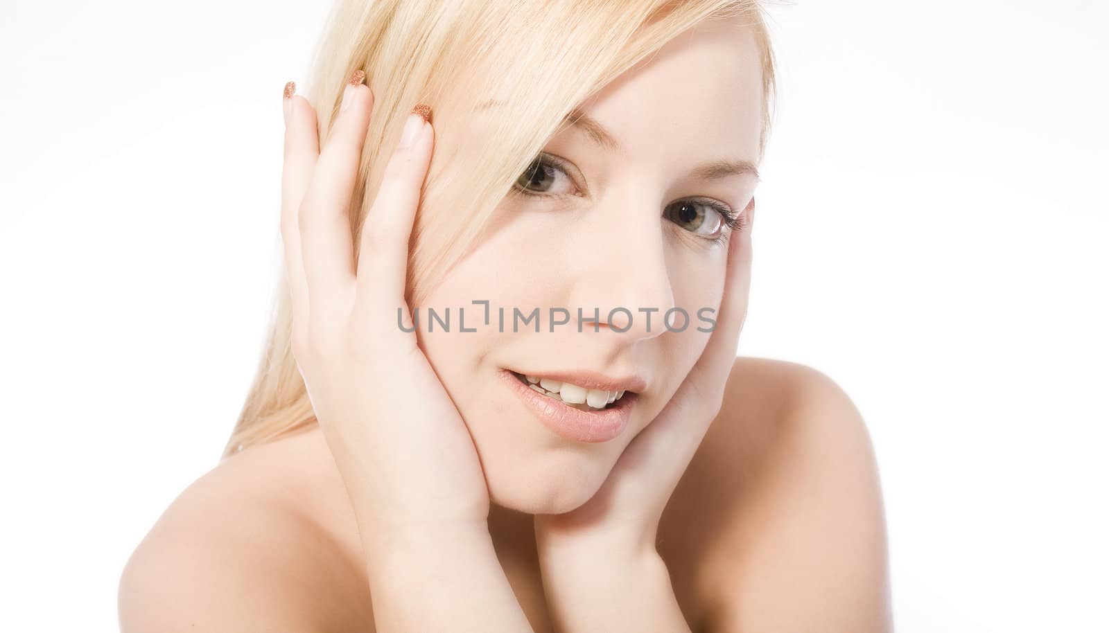 Studio portrait of a young blond woman looking cute