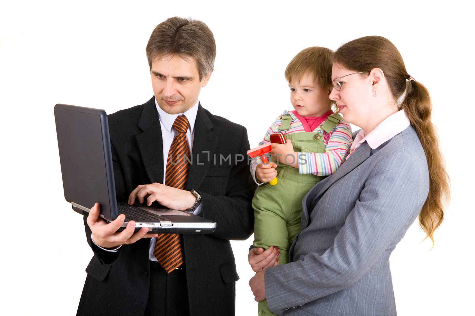 family looking into the screen of laptop by vsurkov