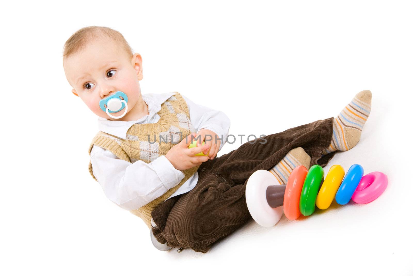 small boy with pyramid in hands