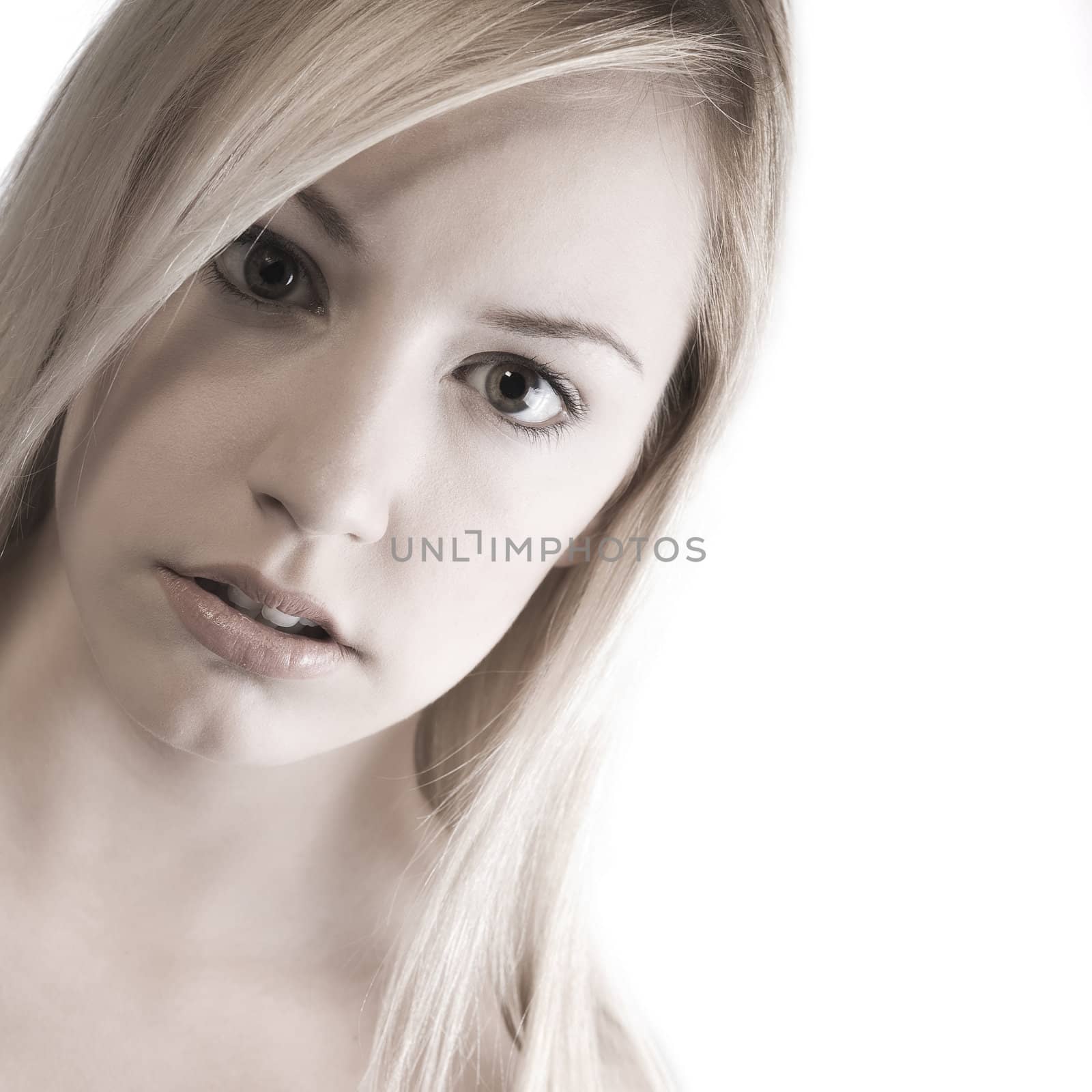Studio portrait of a young blond woman looking beautiful