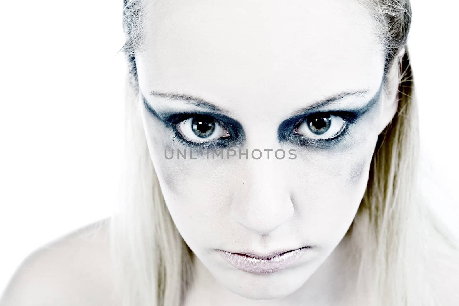 Studio portrait of a young blond woman looking horrible