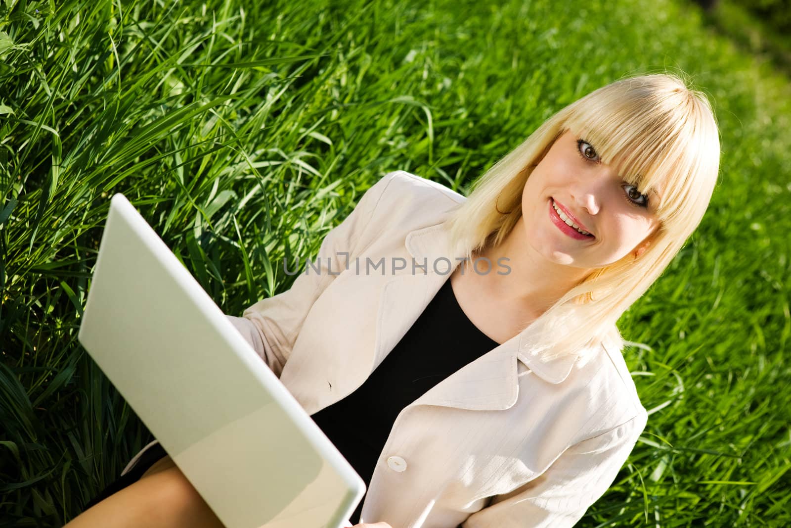 smiling blond girl with notebook