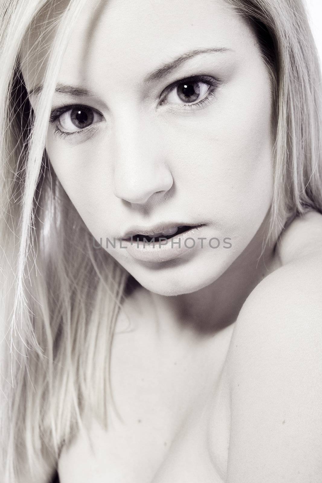 Studio portrait of an expressive young blond woman  by DNFStyle