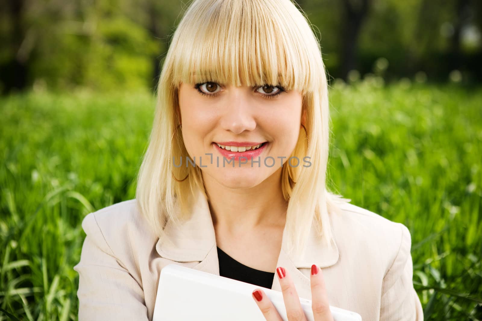 portrait of blond girl with laptop