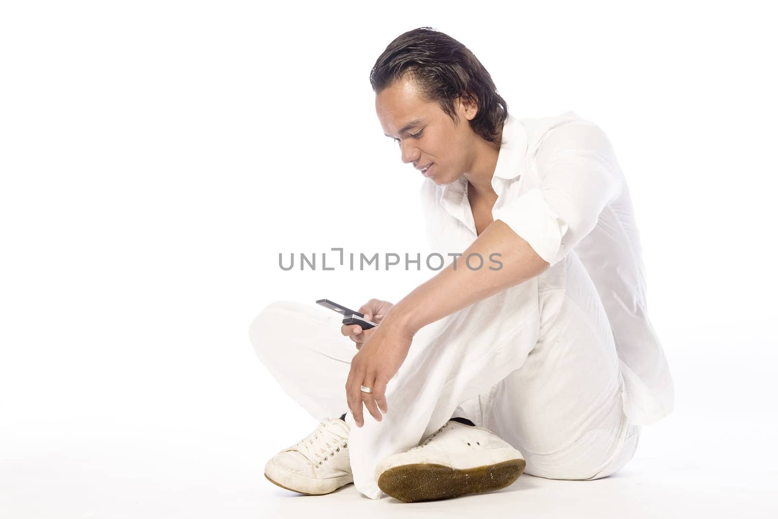 Studio portrait of a muscular Asian sexy looking boy calling