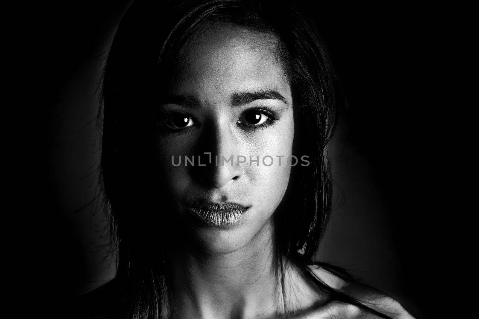 Studio portrait of a beautiful mixed race, vietnamese girl in black and white