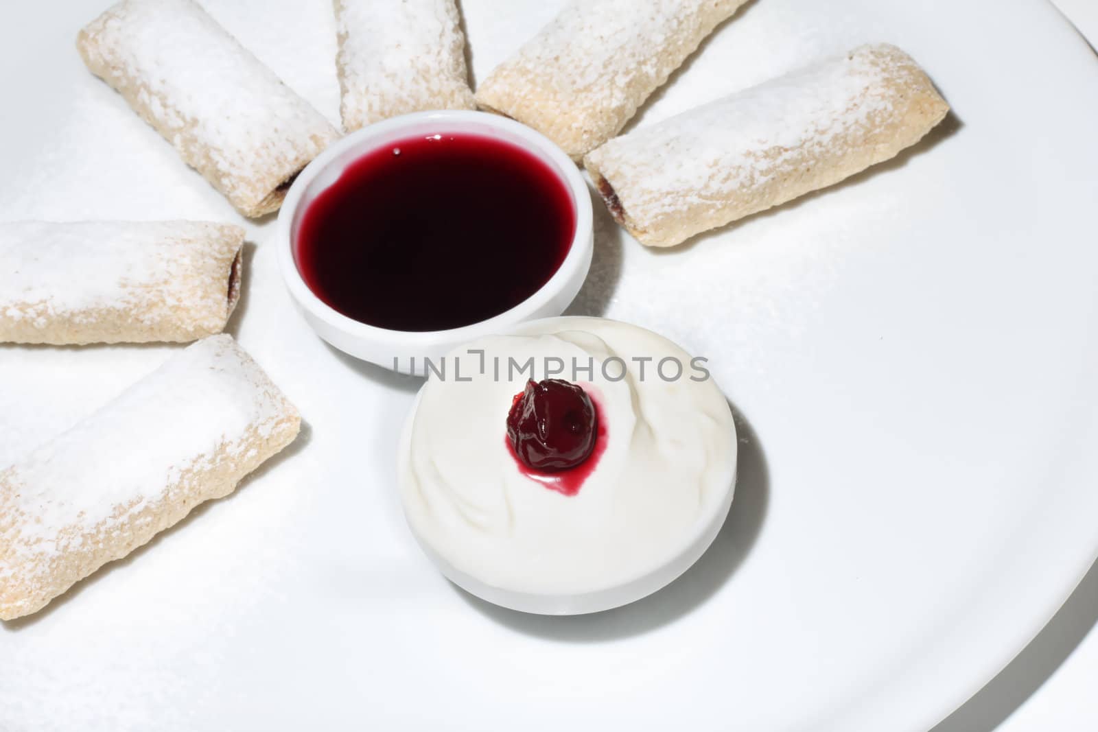 Dipping dessert with powdered sugar by Dven