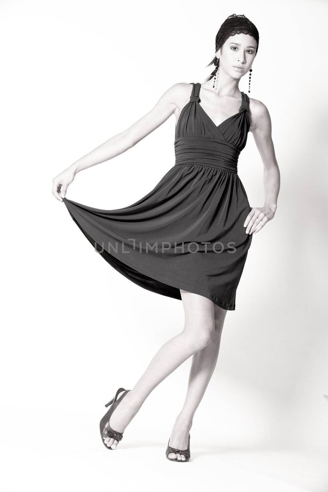 Studio portrait of a beautiful mixed race, vietnamese girl showing her skirt