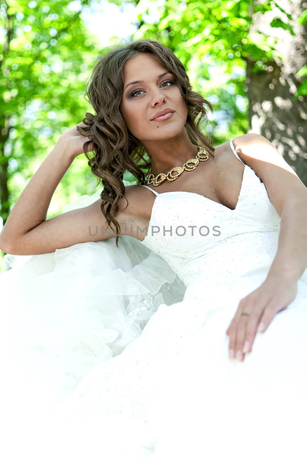 portrait of a beautiful young bride in the park