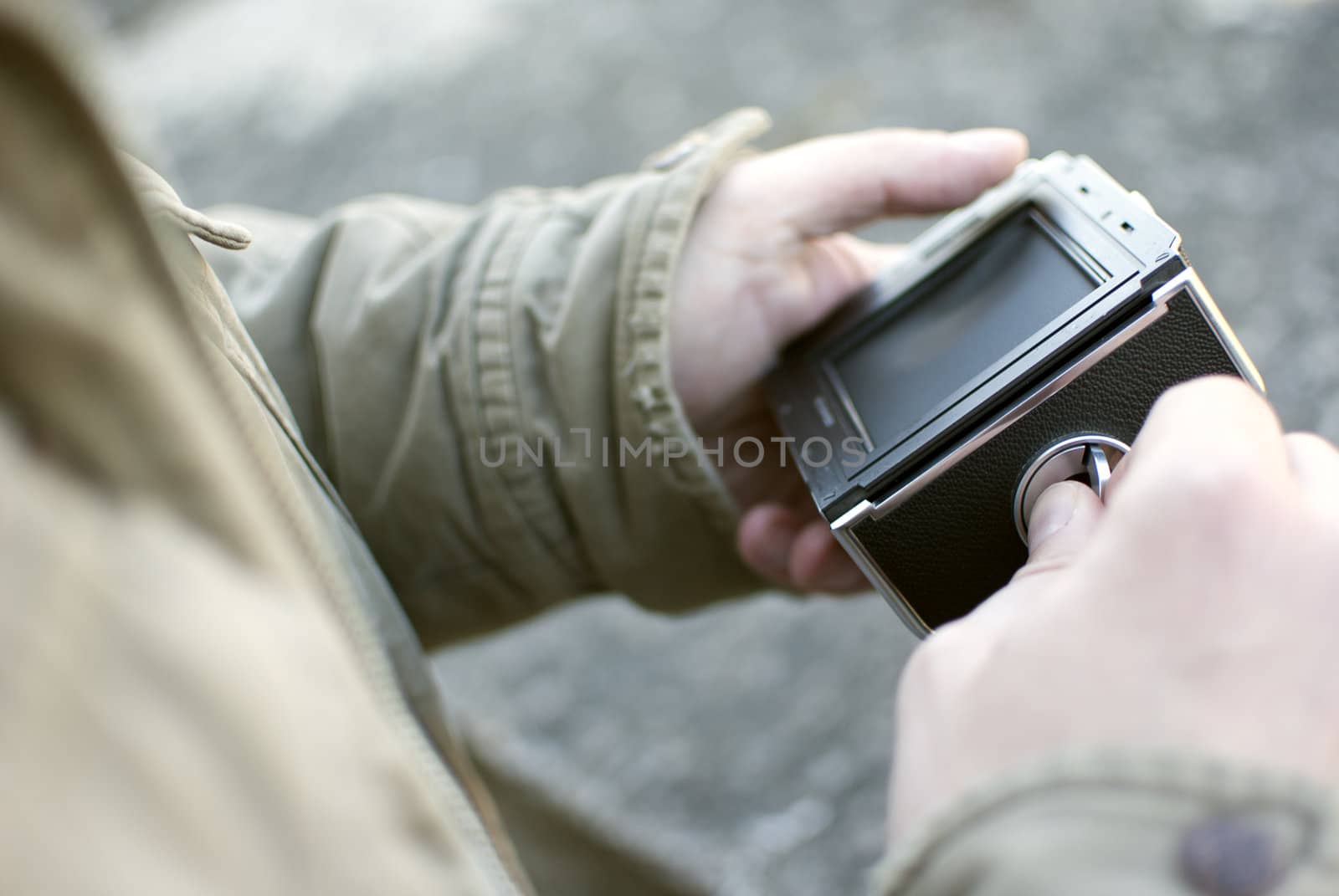 male hands holding old fleshmeter, closeup