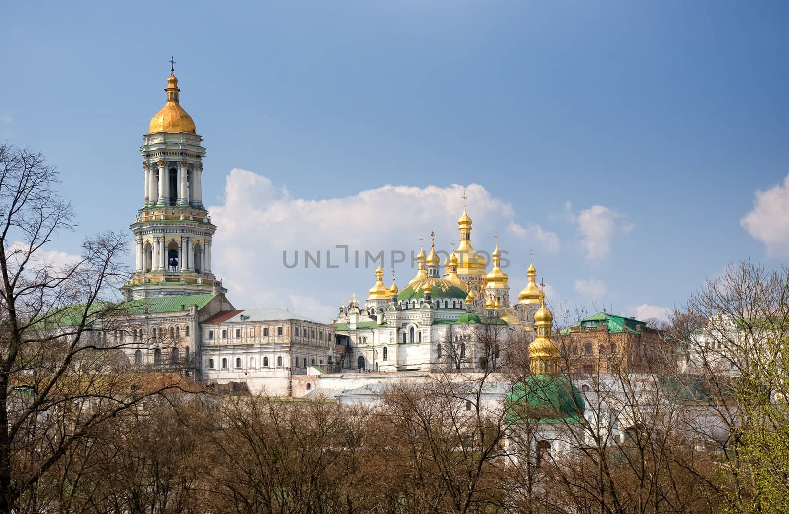 Golden church domes on blue sky background