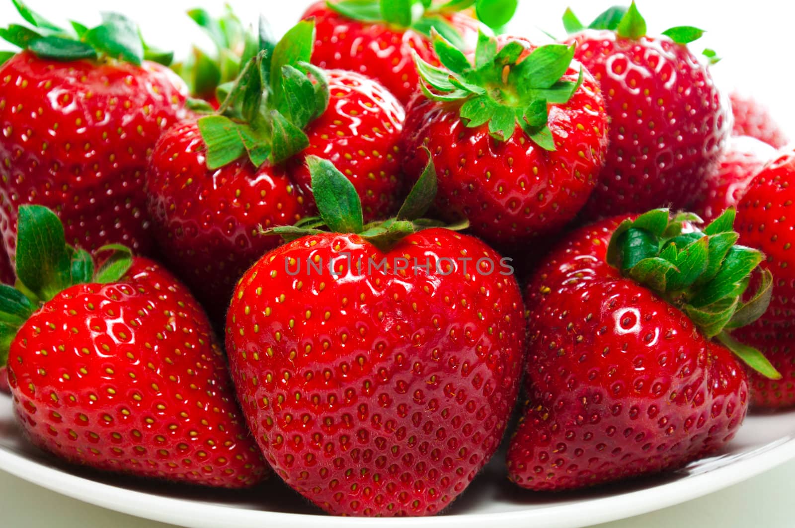 Strawberries on a plate by lobzik